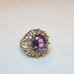 !!STOLEN!! 14 Carat Yellow Gold Ring with Oval Cut Purple Garnet and Cubic Zirconia surround